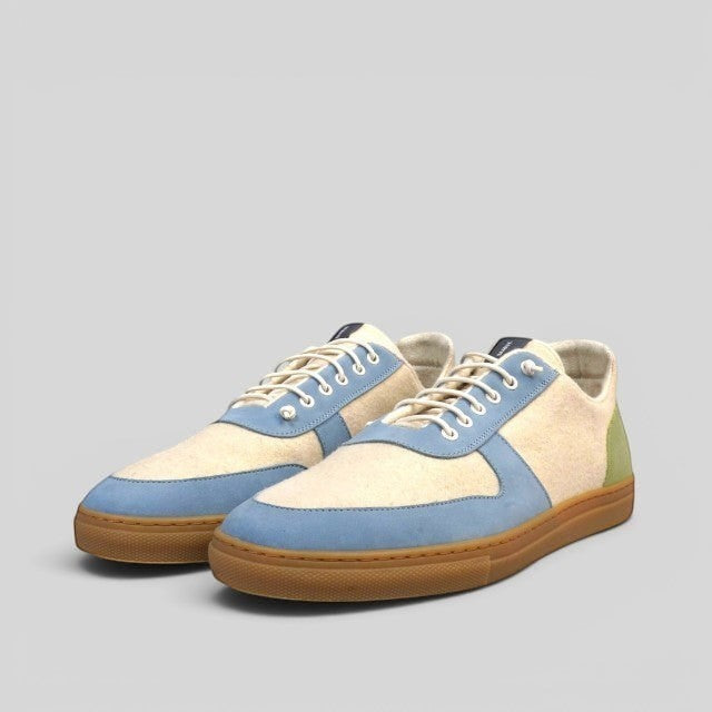 Baabuk Urban Wooler Wonderland sneakers in cream wool with blue nubuck accents and a gum rubber sole.