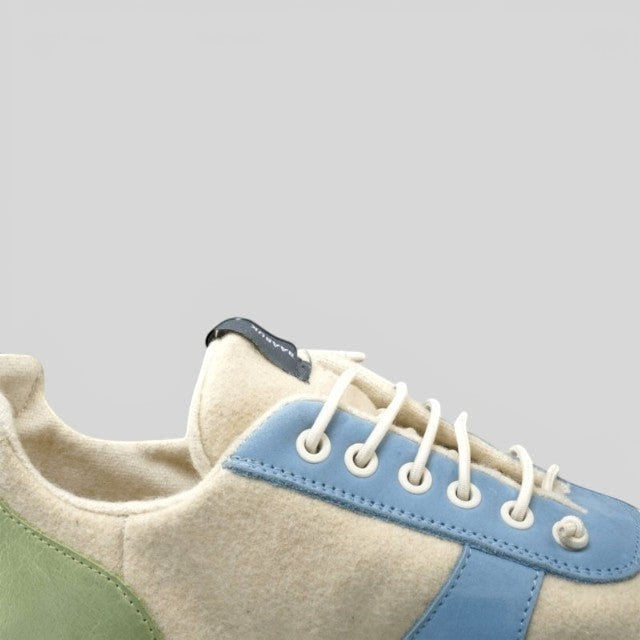 Baabuk Urban Wooler Wonderland sneakers featuring cream wool, light blue nubuck trim, and green suede heel detail.