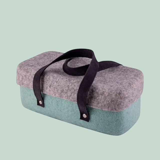 Baabuk light blue and grey wool beer cooler with black leather straps, perfect for picnics and BBQs.