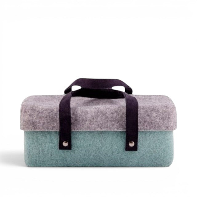 Baabuk light blue and grey wool beer cooler with dark straps and silver rivets. Handmade in Nepal.