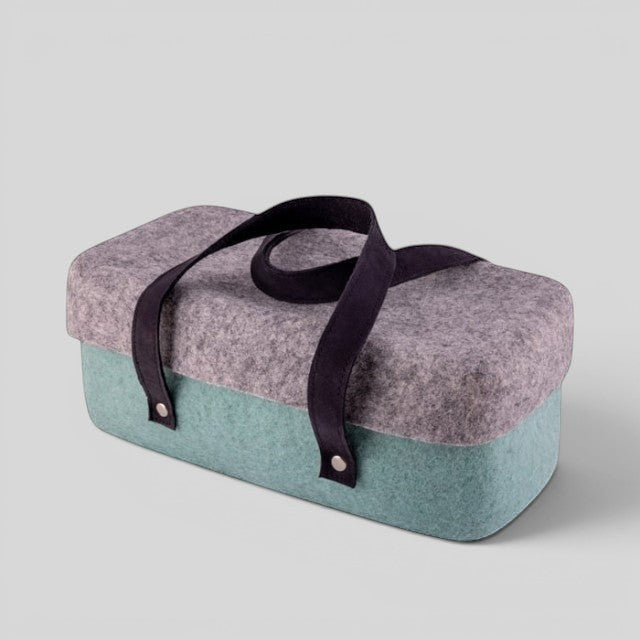 Baabuk light blue and grey wool beer cooler with black leather straps, perfect for picnics and BBQs.