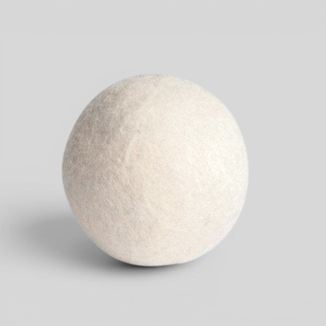 Baabuk handcrafted white wool dryer ball for sustainable, chemical-free laundry softening and faster drying.