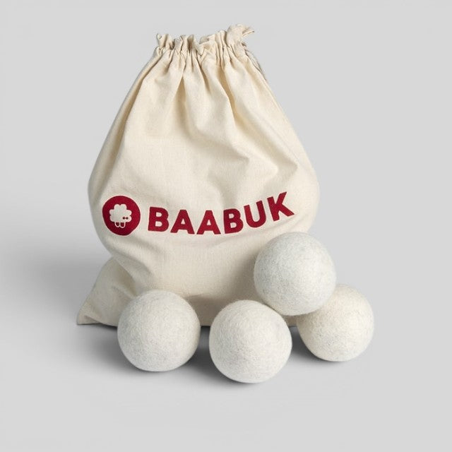 Baabuk 4 pack of white wool dryer balls in a natural canvas bag, eco-friendly laundry accessory.