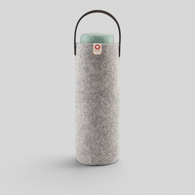 Baabuk light grey wool wine cooler with a leather carrying strap, designed for eco-friendly bottle insulation.